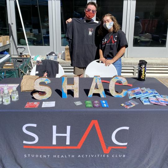 Two students tabling for SHAC