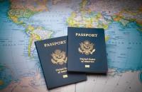 Photo of passports sitting on a map
