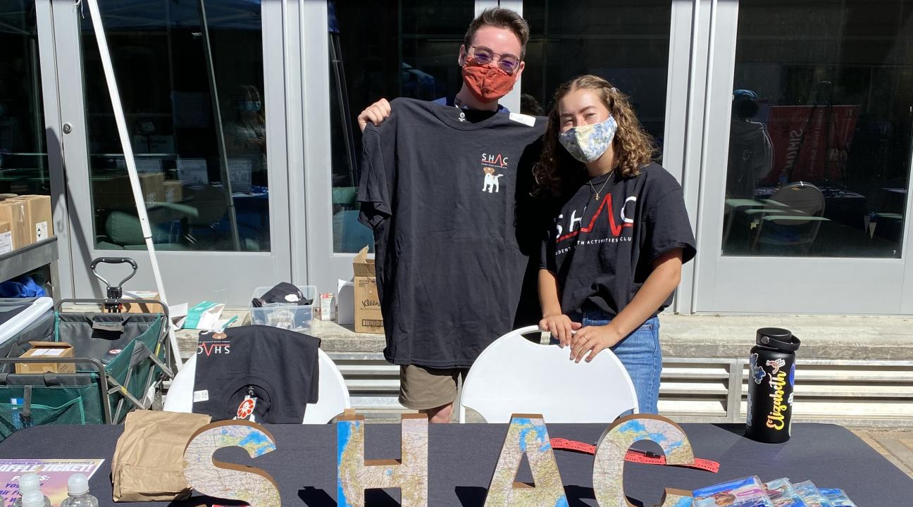 Two students tabling for SHAC