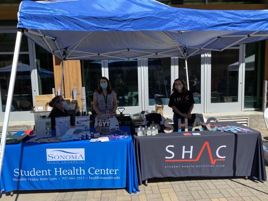 Picture of SHAC tabling outside of the student center.