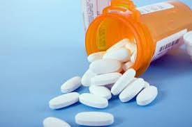 Photo of pills spilling from a prescription bottle